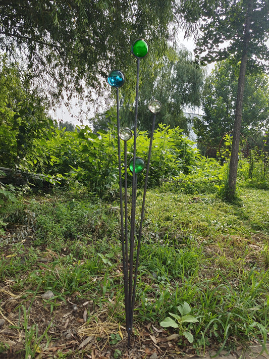 Elegant metal garden stake with artistic glass decoration