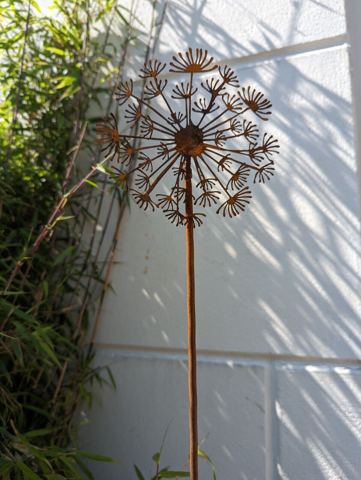 Rust garden stake dandelion dandelion clock